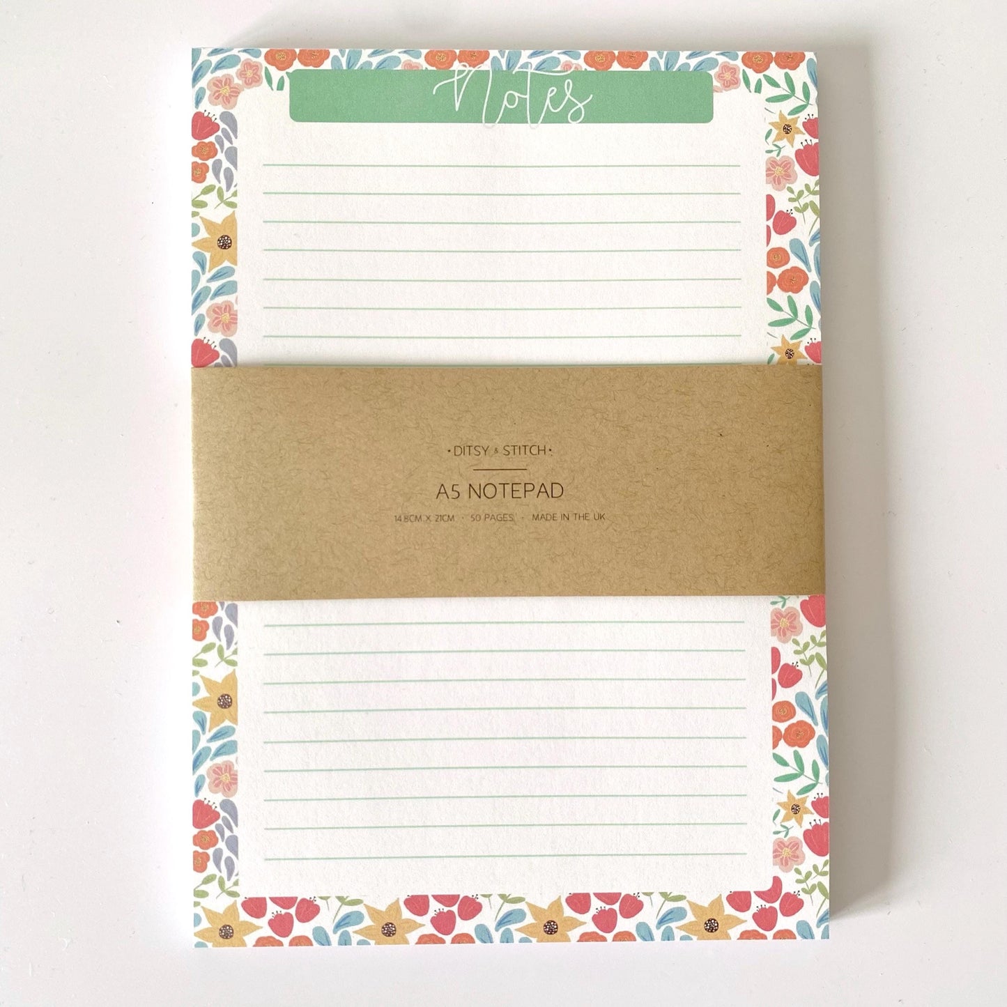 Notepad with floral border and 'Notes' label on a white background