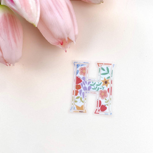 Letter 'H' sticker with floral design on a white background