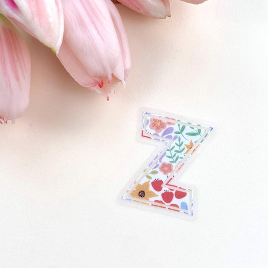 Decorative letter 'Z' sticker with floral patterns on a white background