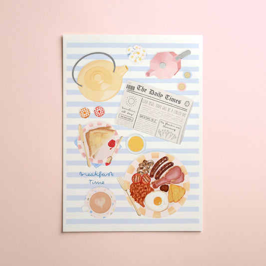 A rectangular art print featuring a breakfast illustration on a light blue and white striped background, with illustrated items like a teapot, newspaper, toast, eggs, beans, bacon, and a cup, displayed against a soft pink background.