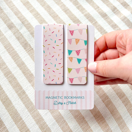 Magnetic bookmarks with sprinkles and bunting design on a striped fabric background