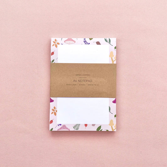 A6 notepad with leaf and mushroom pattern on a pink background
