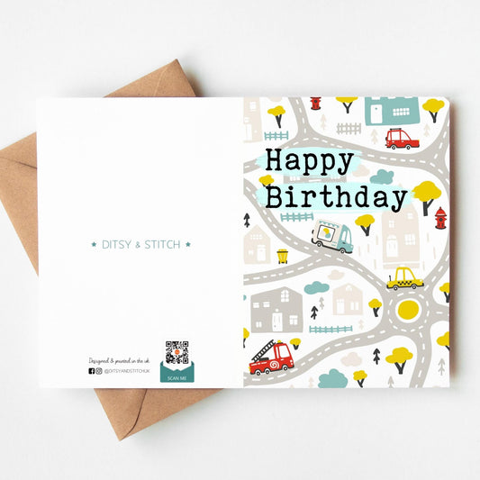 Birthday card with road map design and 'Happy Birthday' text, featuring a brown envelope.