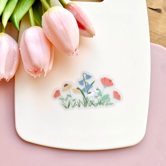 A sticker with colourful garden flowers design on a white background with pink tulips.