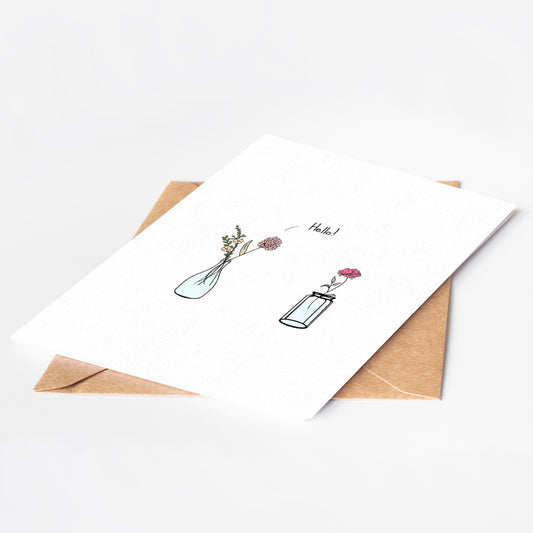 Greeting card with floral design and envelope on a white background