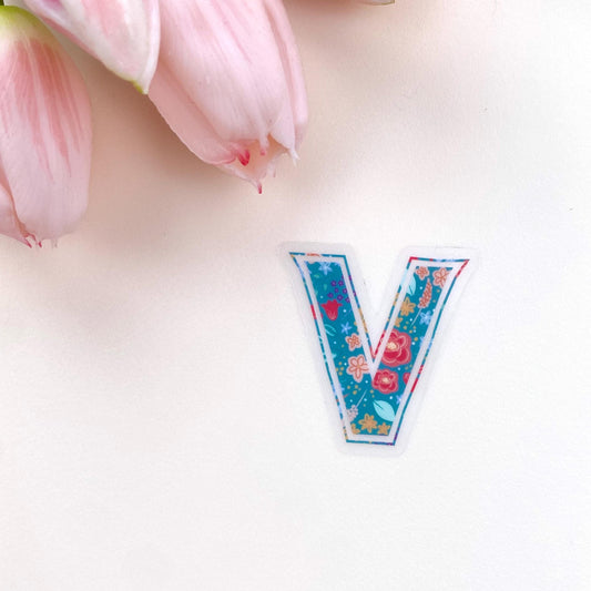 Floral letter 'V' sticker on a white background with pink tulips