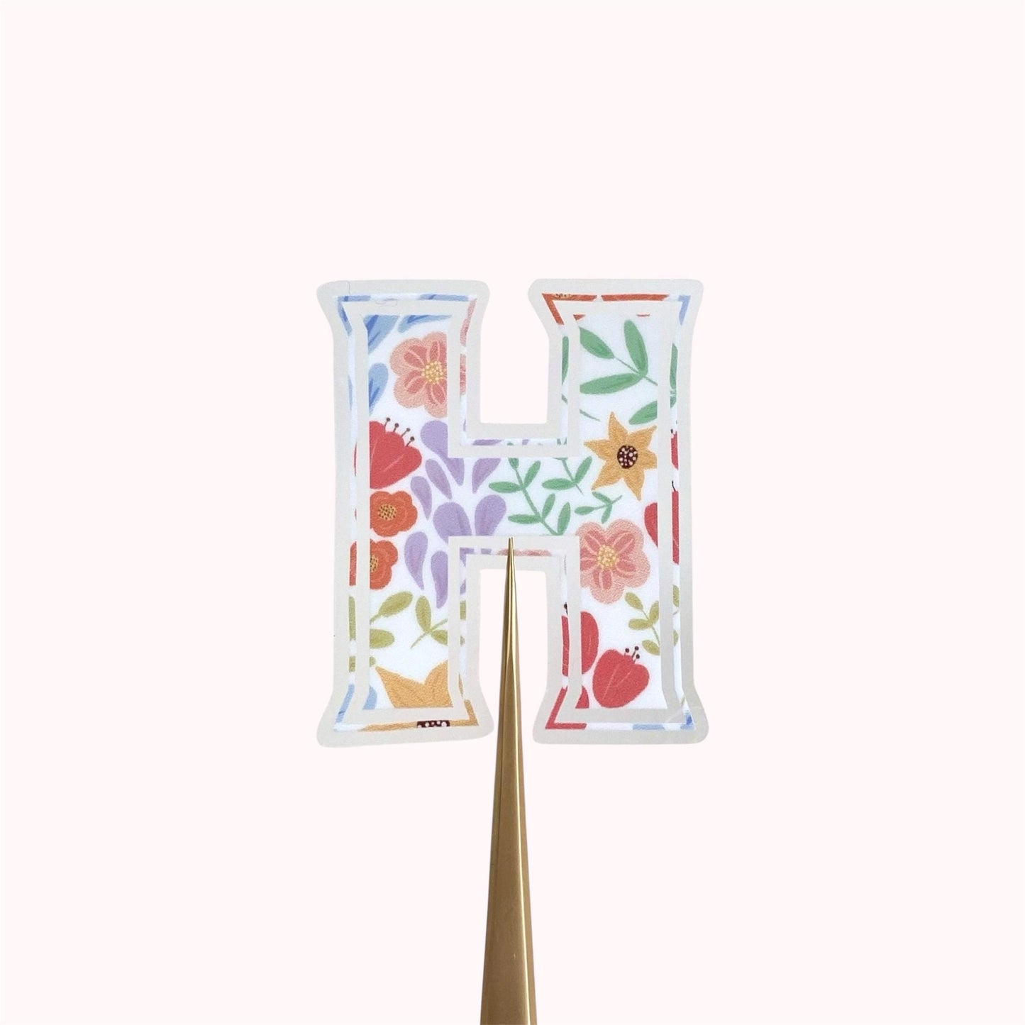Letter 'H' sticker with floral design on a white background