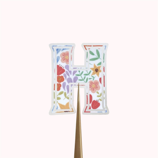 Letter 'H' sticker with floral design on a white background