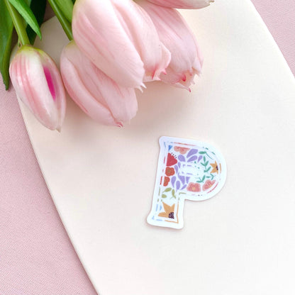 Floral letter 'P' sticker on a cream background with pink tulips.