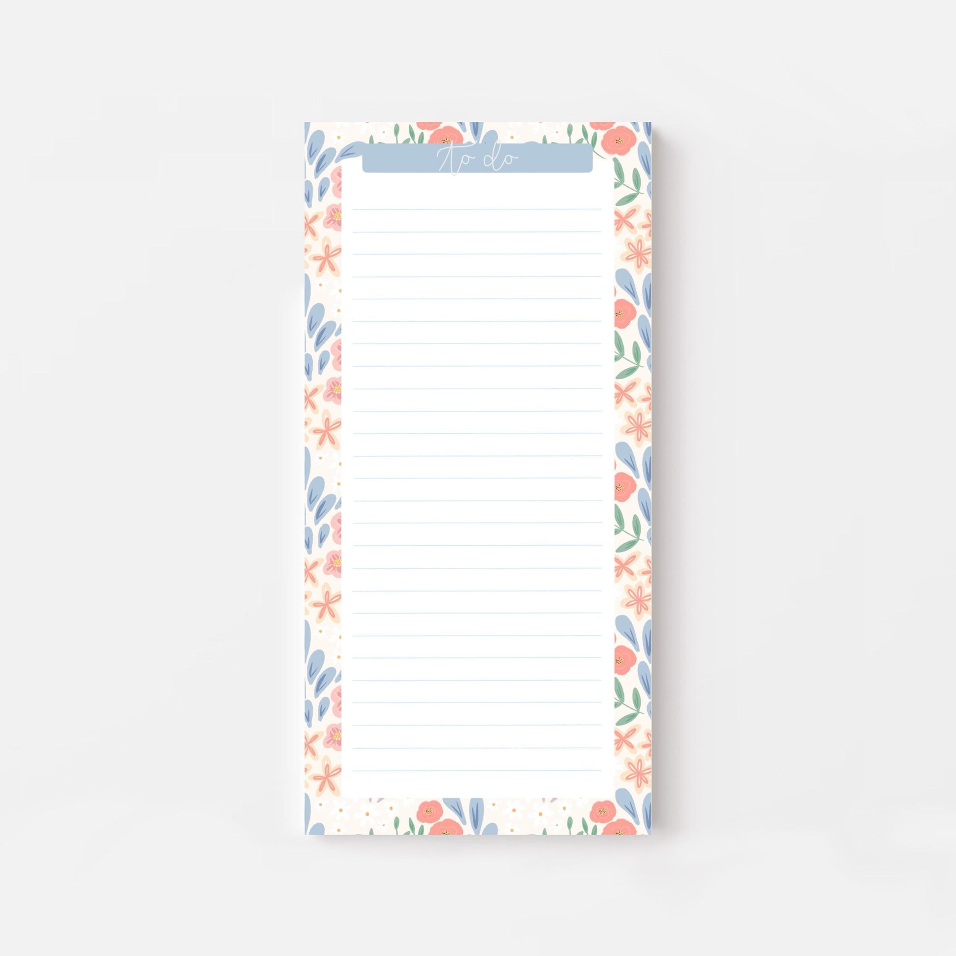 Floral bordered and lined slim notepad on a white background