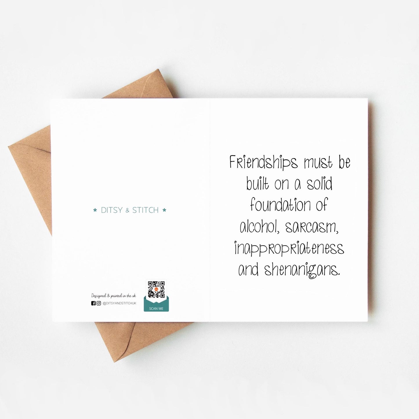 Card with humorous text about friendships and an envelope on a white background