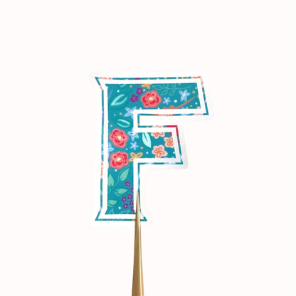 Floral-themed letter 'F' sticker on a white background