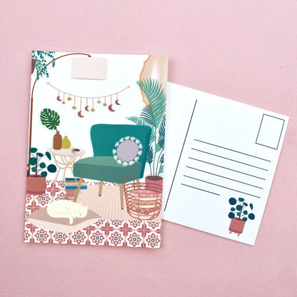 Illustrated postcard with a teal chair and plants on a pink background