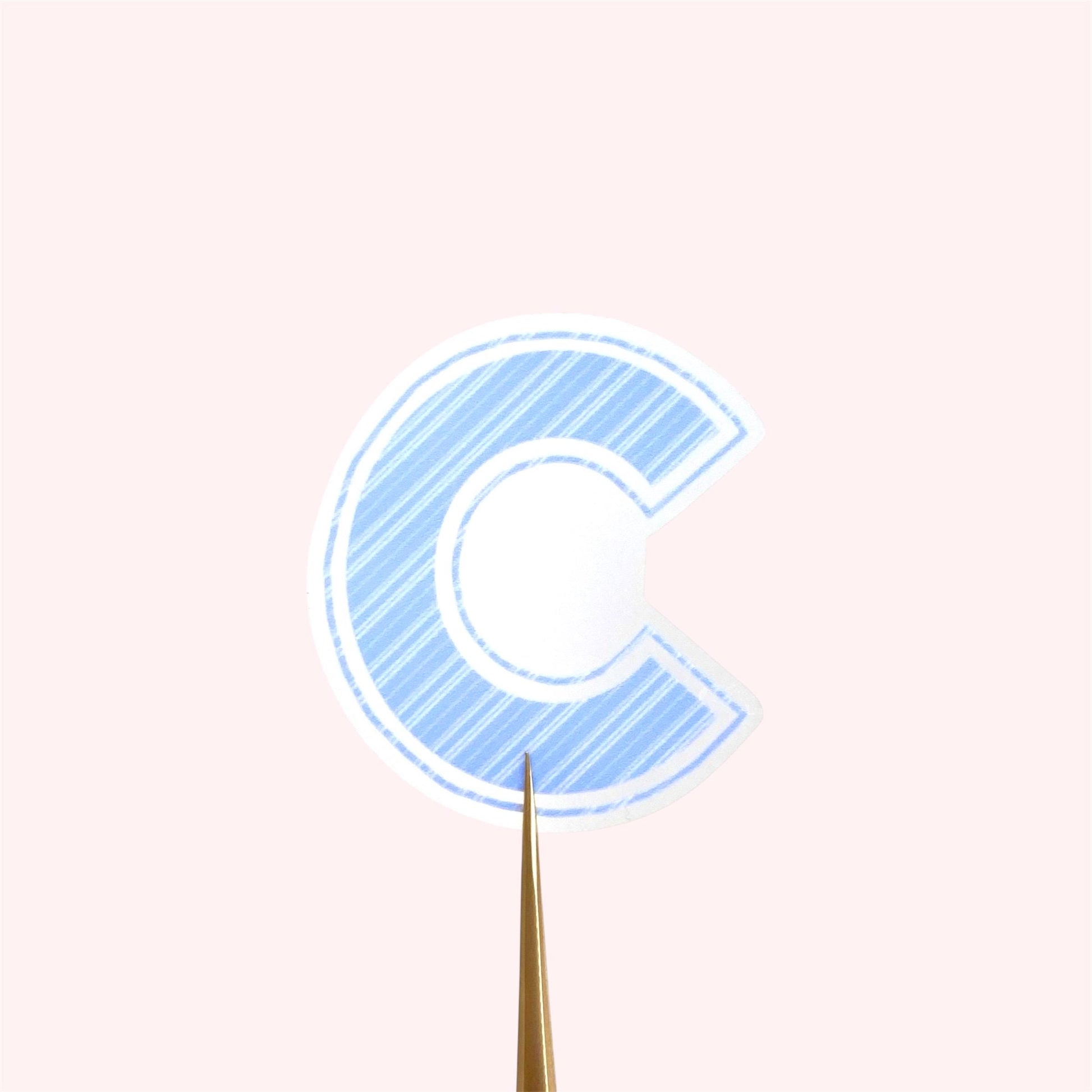 Blue striped  letter 'C' transparent sticker on a white background