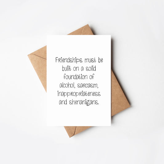Card with humorous friendship quote on a white background