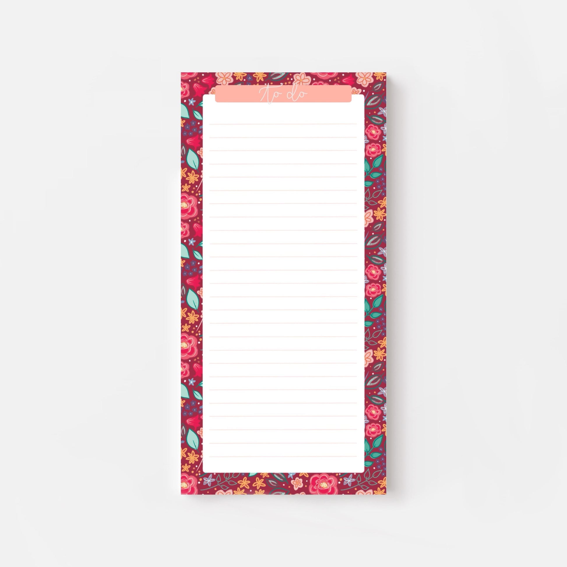 Floral-patterned slim notepad with a pink border on a white background