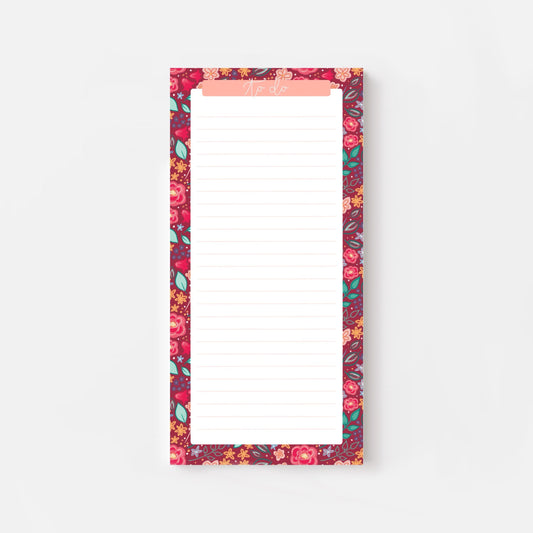 Floral-patterned slim notepad with a pink border on a white background