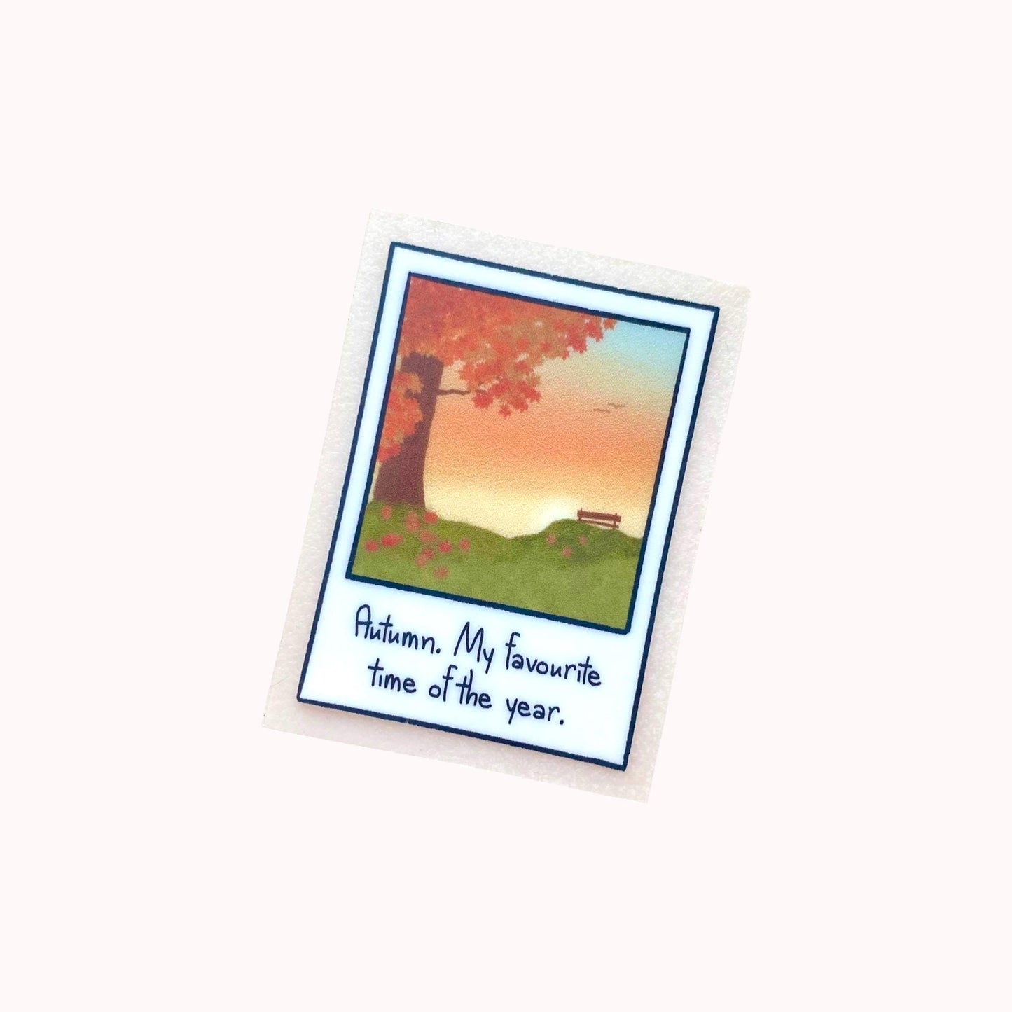 Polaroid sticker with autumn-themed illustration and text on a white background
