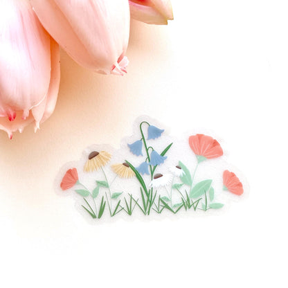 Transparent garden flowers sticker on a white background with pink tulips at the top.
