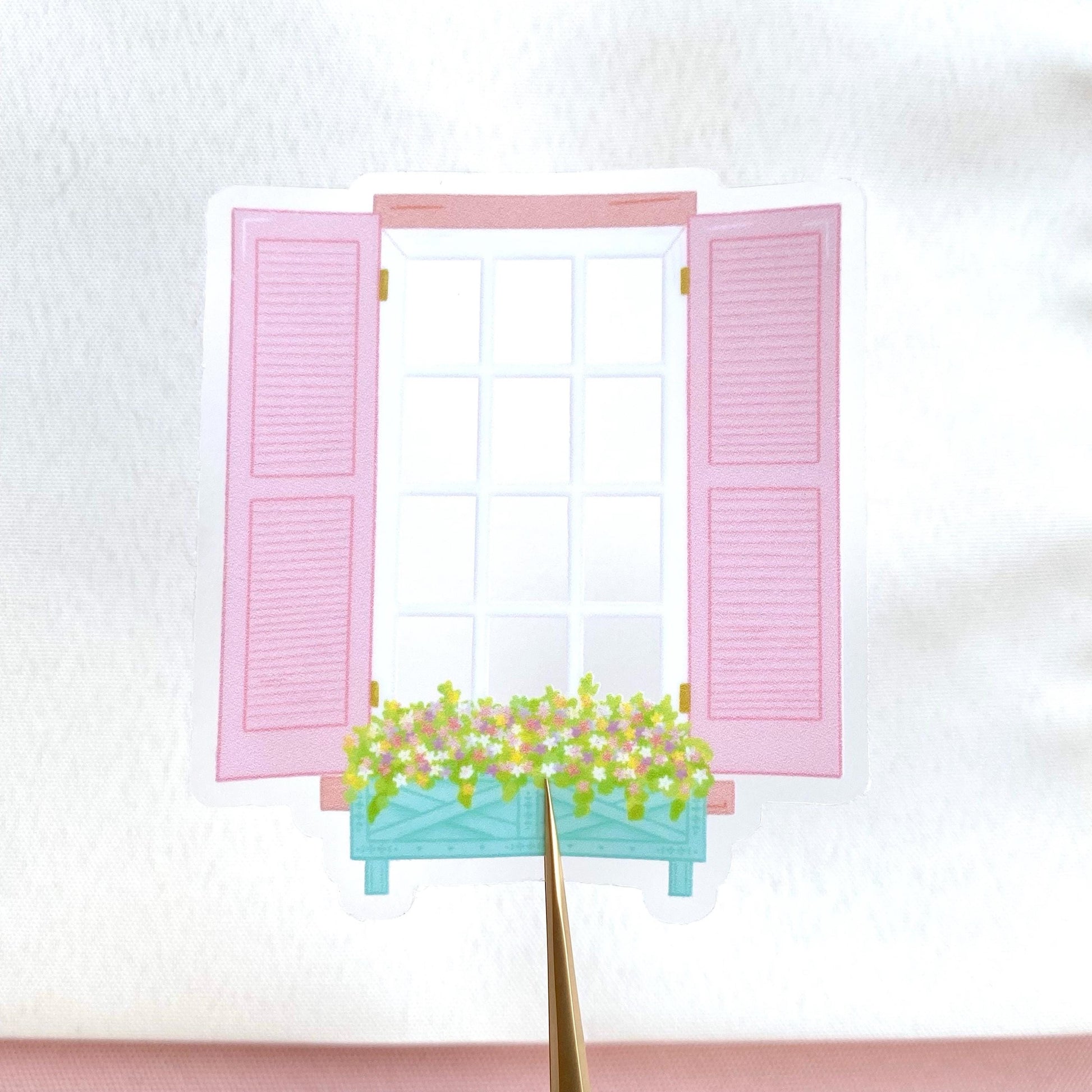 Transparent sticker of a window with pink shutters and a flower box on a white background