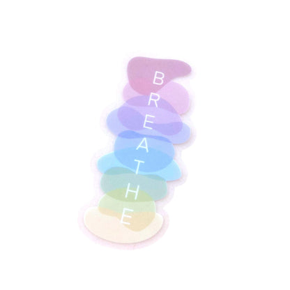 Sticker with a stack of pastel-coloured stones with 'BREATHE' text on a white background
