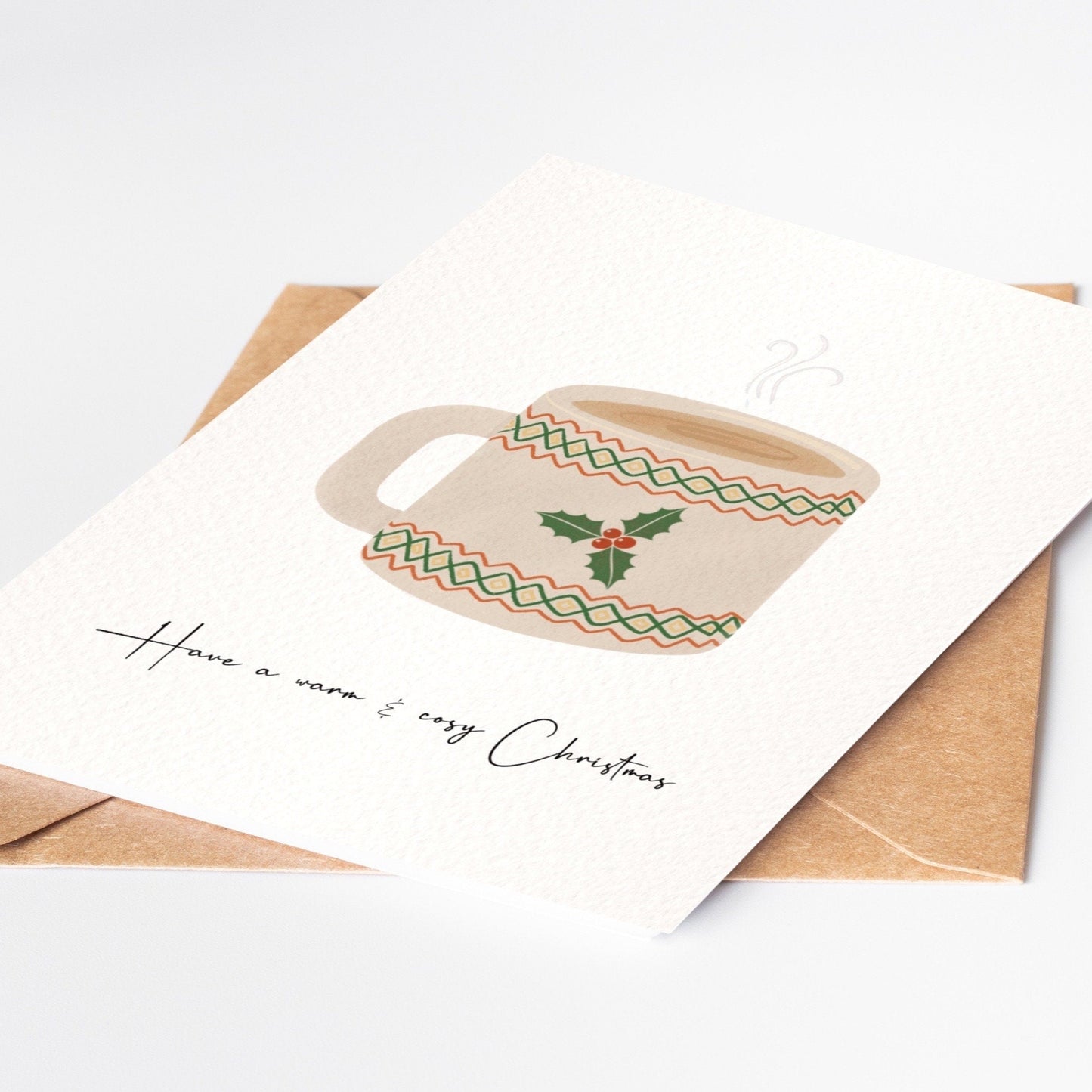 Christmas card with a mug design and 'Have a warm and cozy Christmas' text on a white background.