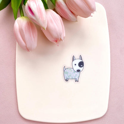 Sticker with a dog illustration on a pink surface with pink tulips.