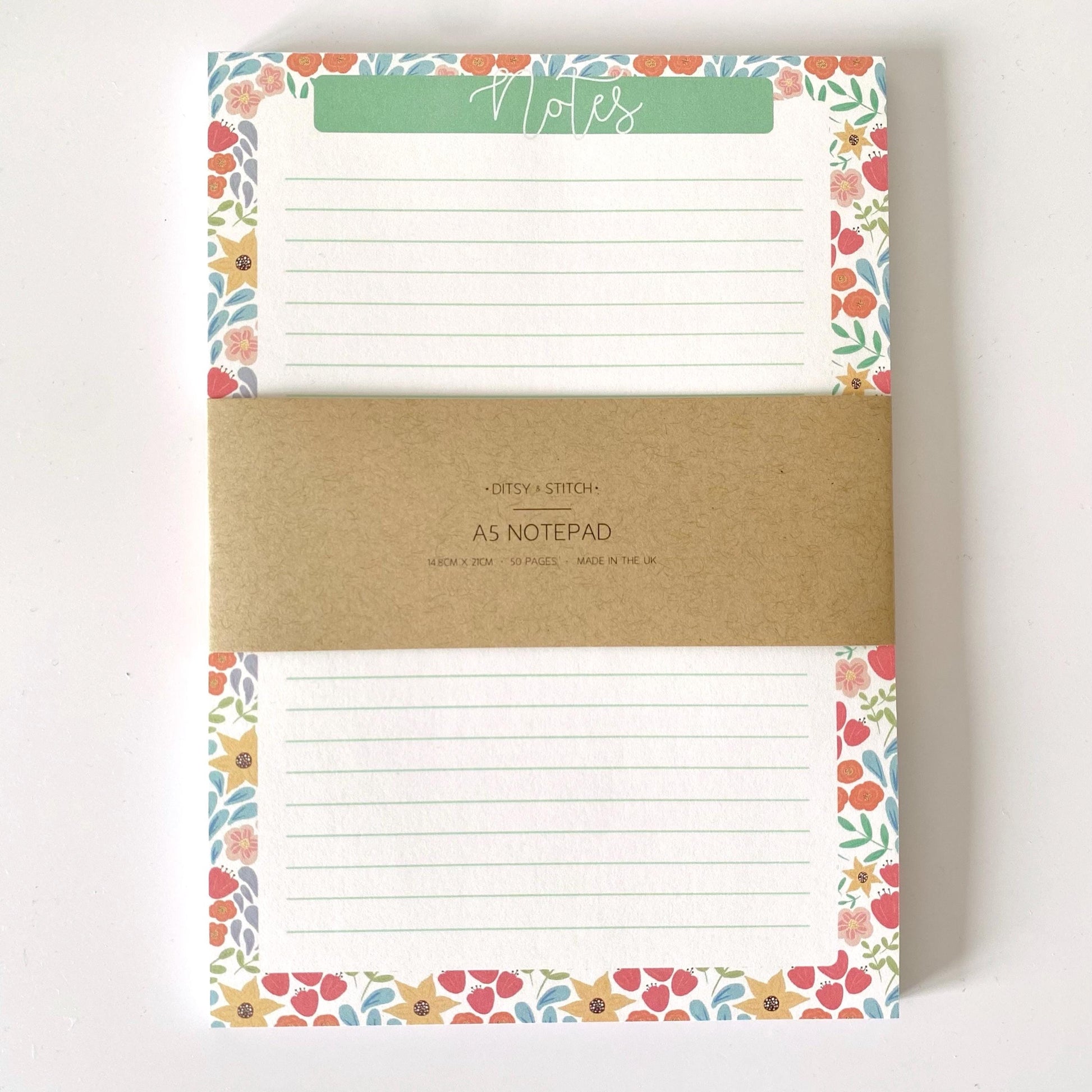 Notepad with floral border and 'Notes' label on a white background
