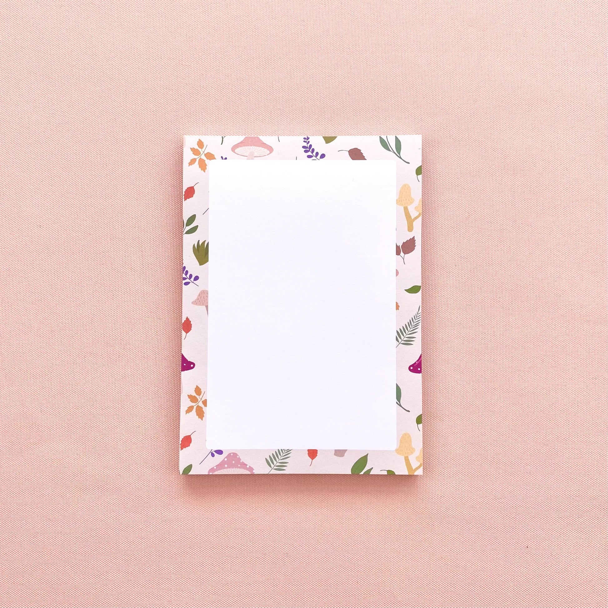 A6 notepad with leaf and mushroom pattern on a pink background