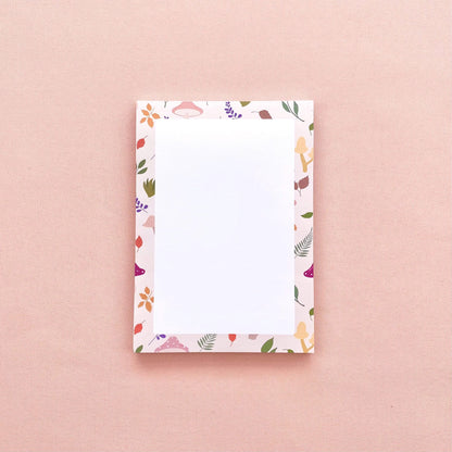 A6 notepad with leaf and mushroom pattern on a pink background