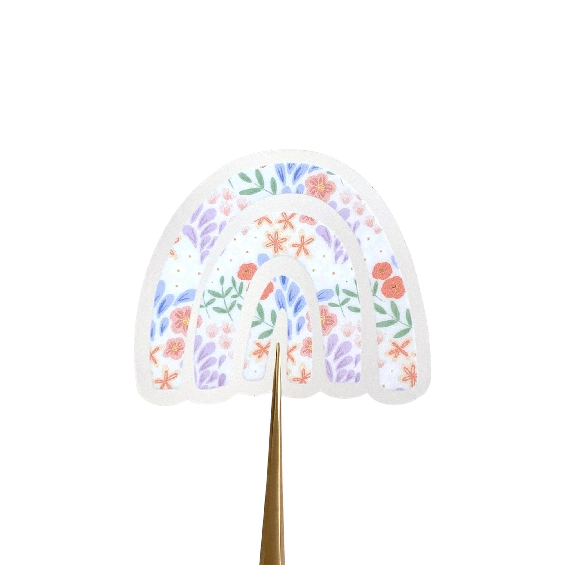 Decorative rainbow shaped sticker with floral patterns on a white background