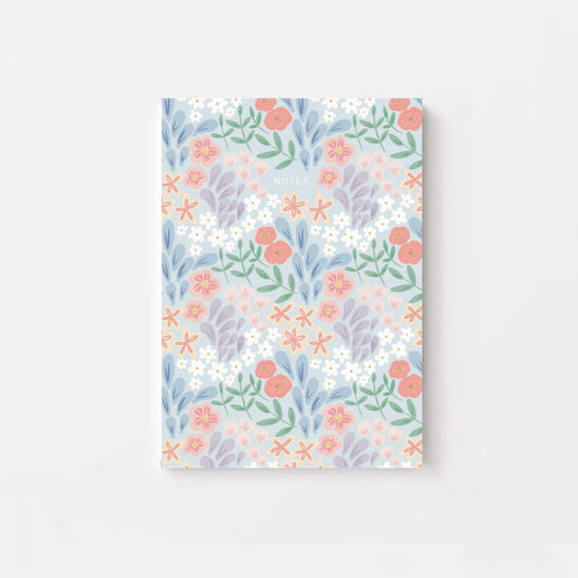 Floral patterned notebook on a light gray background