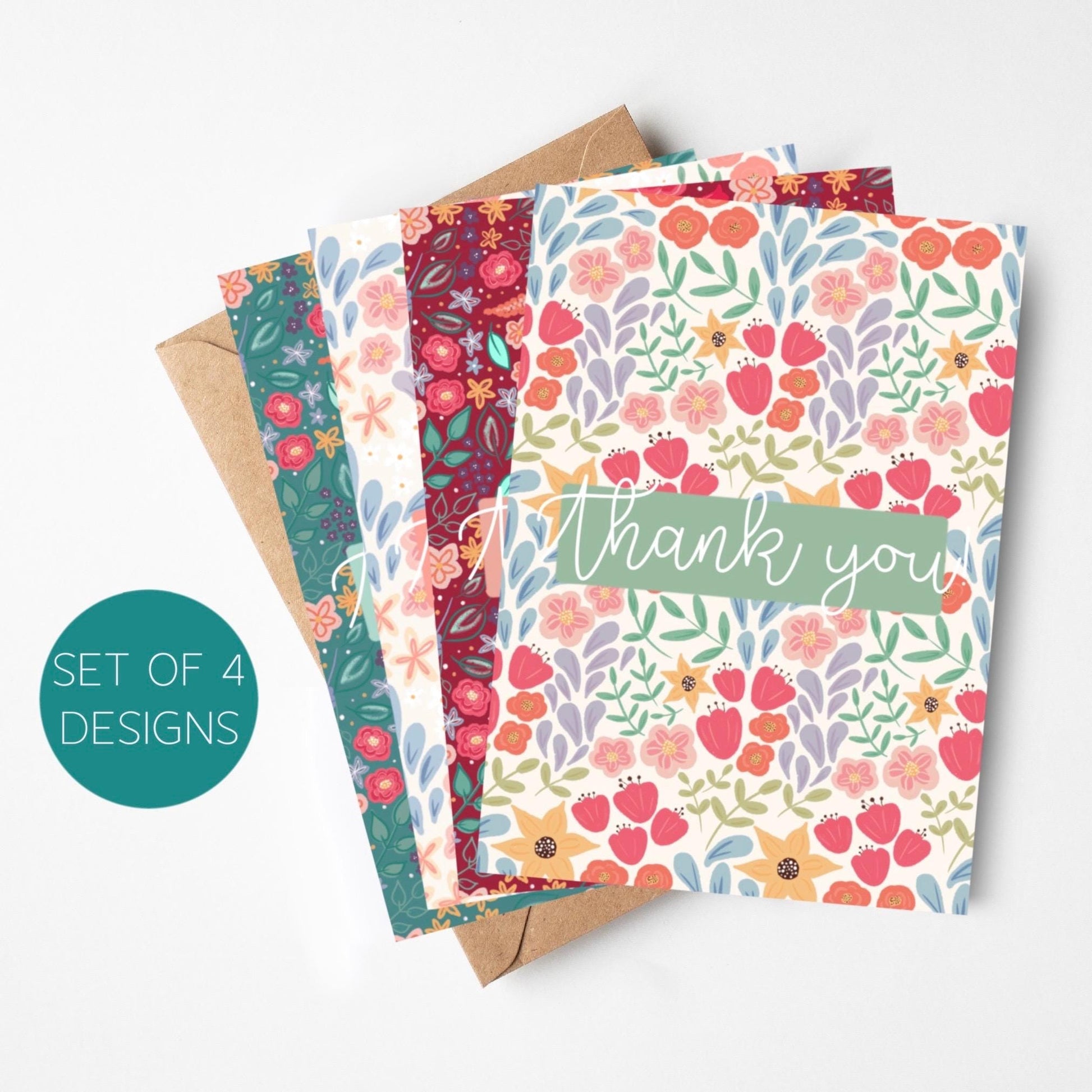 Set of four floral greeting cards with a 'thank you' card on a white background