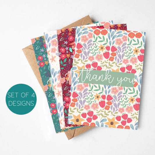 Set of four floral greeting cards with a 'thank you' card on a white background
