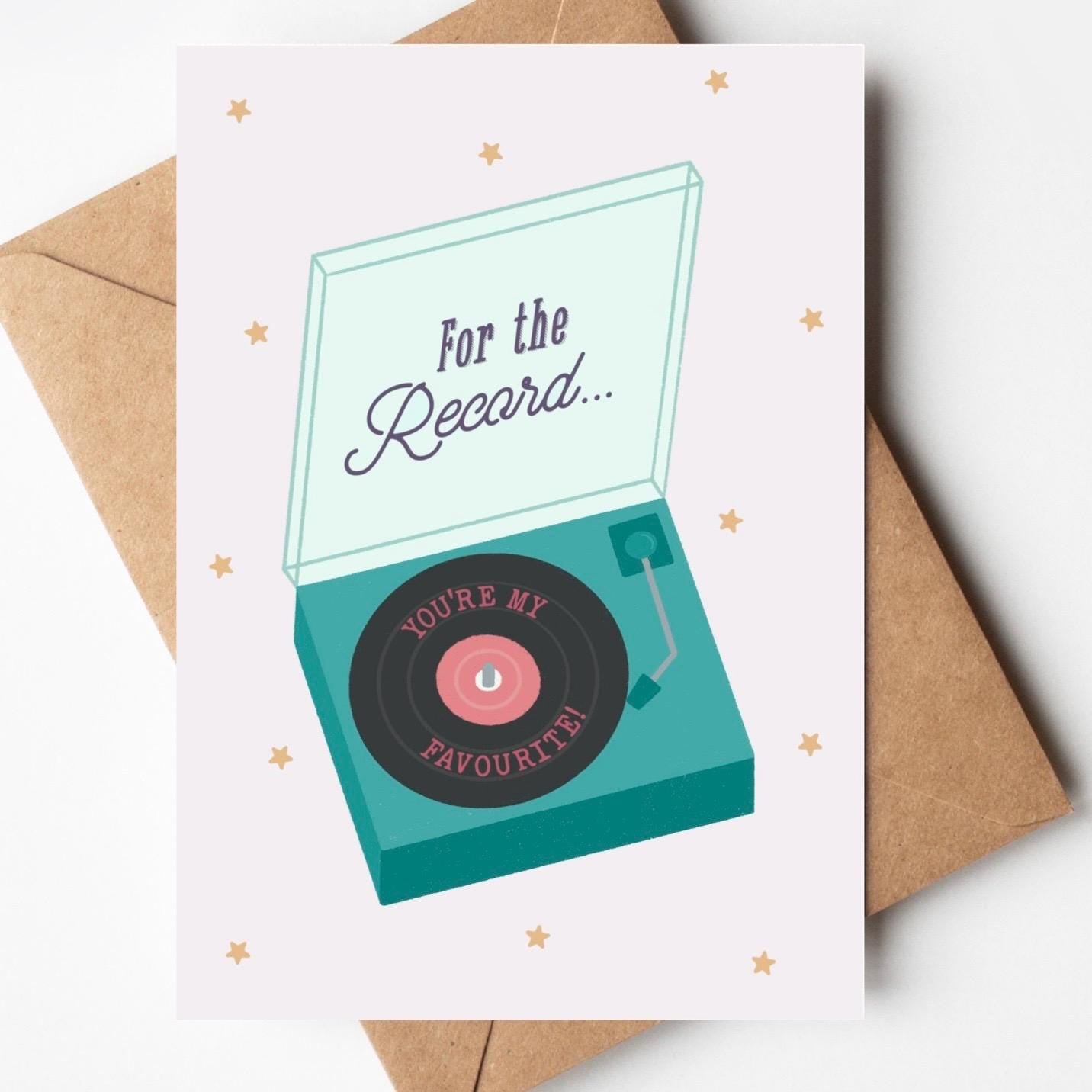 Greeting card with record player design  and 'For the record... you're my favourite' message and an envelope on a white background