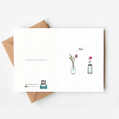 Greeting card with floral illustrations and 'Ditsy & Stitch' branding on the back on a white background.