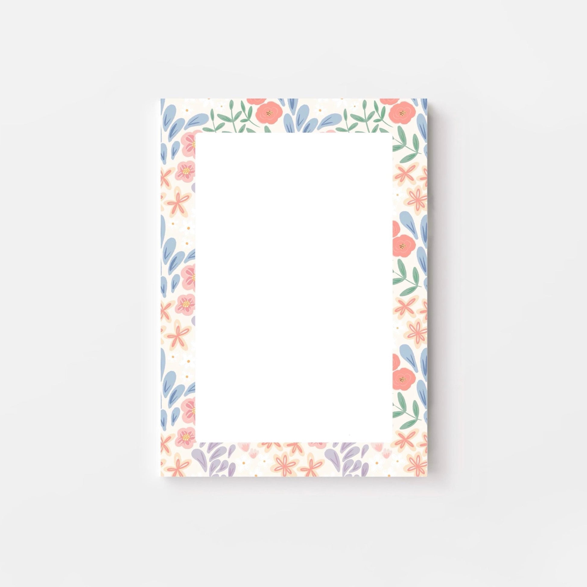 Floral border notepad on a pink background