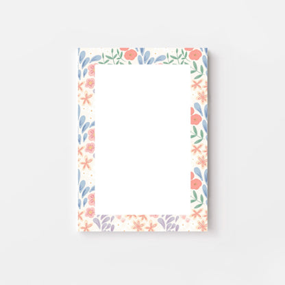 Floral border notepad on a pink background