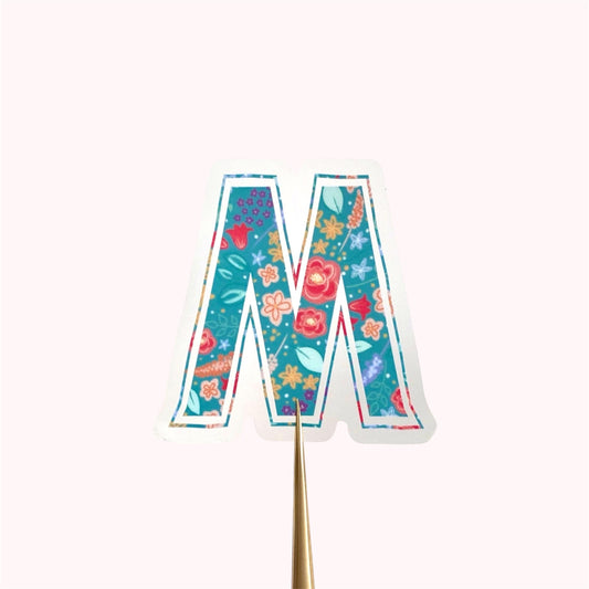 Colourful letter 'M' sticker on a white background