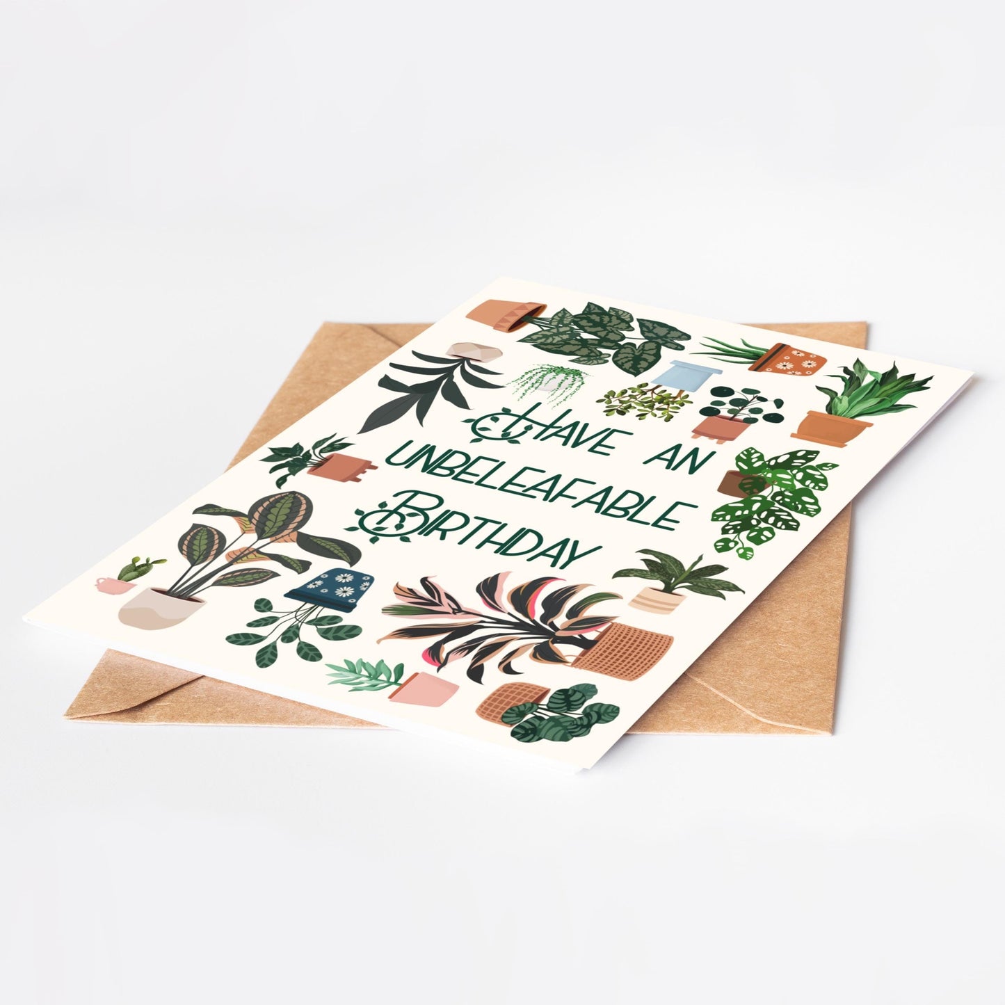 Birthday card with plant illustrations and 'Have an unbeleafable birthday' text on a white background