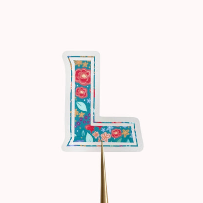 Floral-patterned letter 'L' sticker on a white background