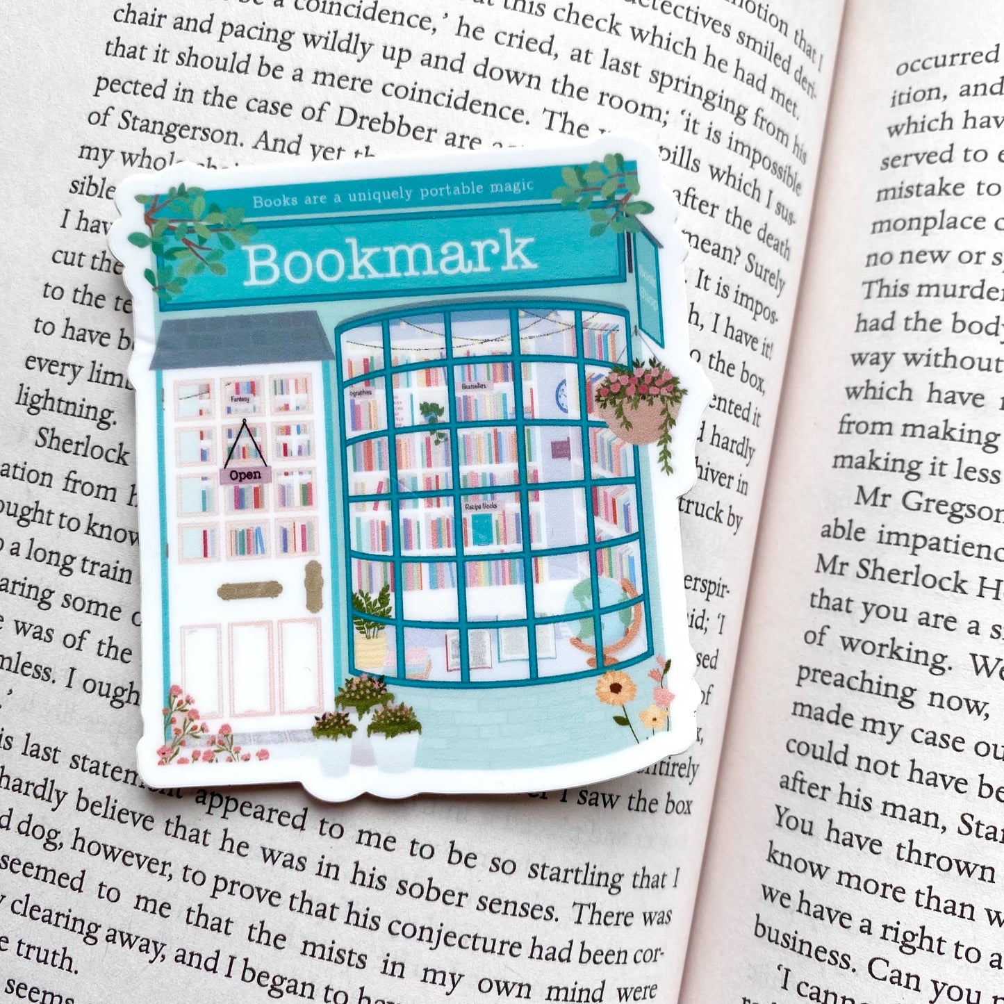 Sticker with a design of a bookshop on an open book