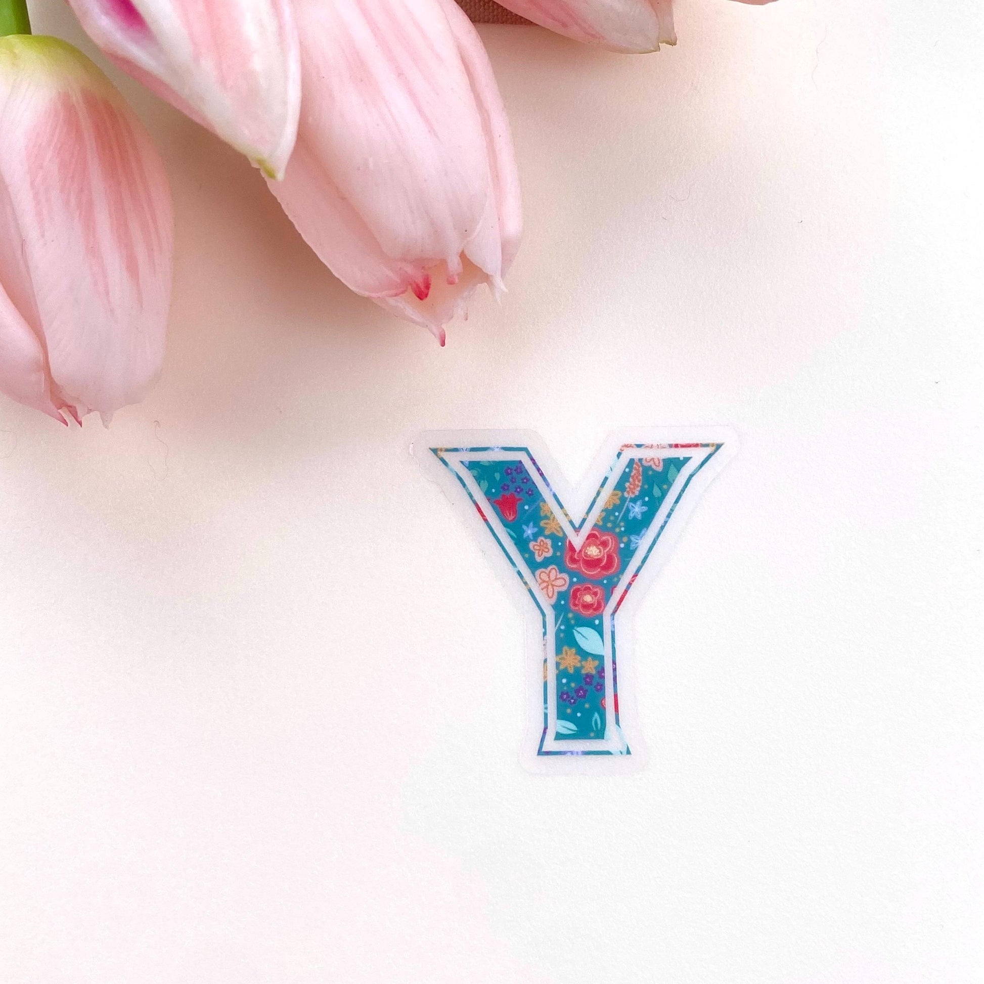 Colourful letter 'Y' sticker with pink tulips on a white background