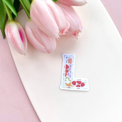 Letter 'L' shaped sticker with floral design on a white background with pink tulips