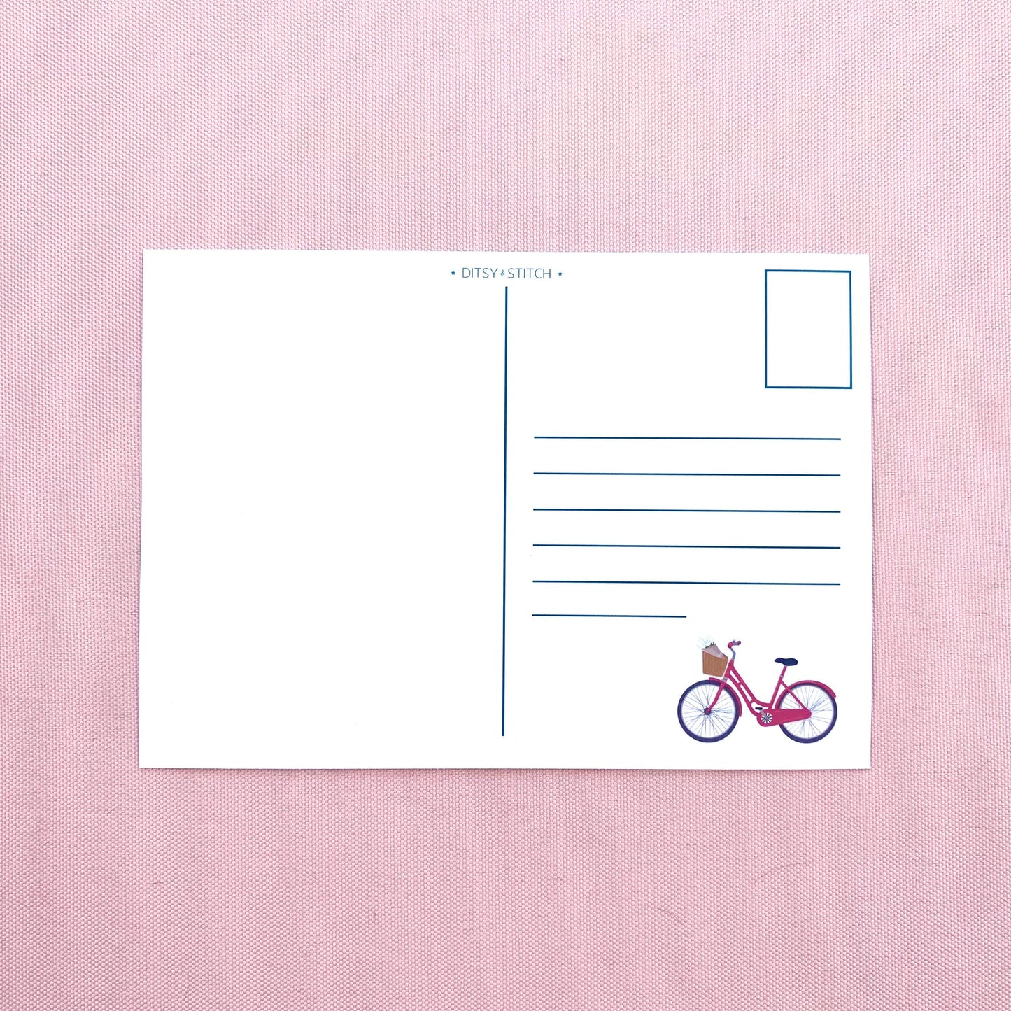 Postcard with a bicycle illustration on a pink textured background