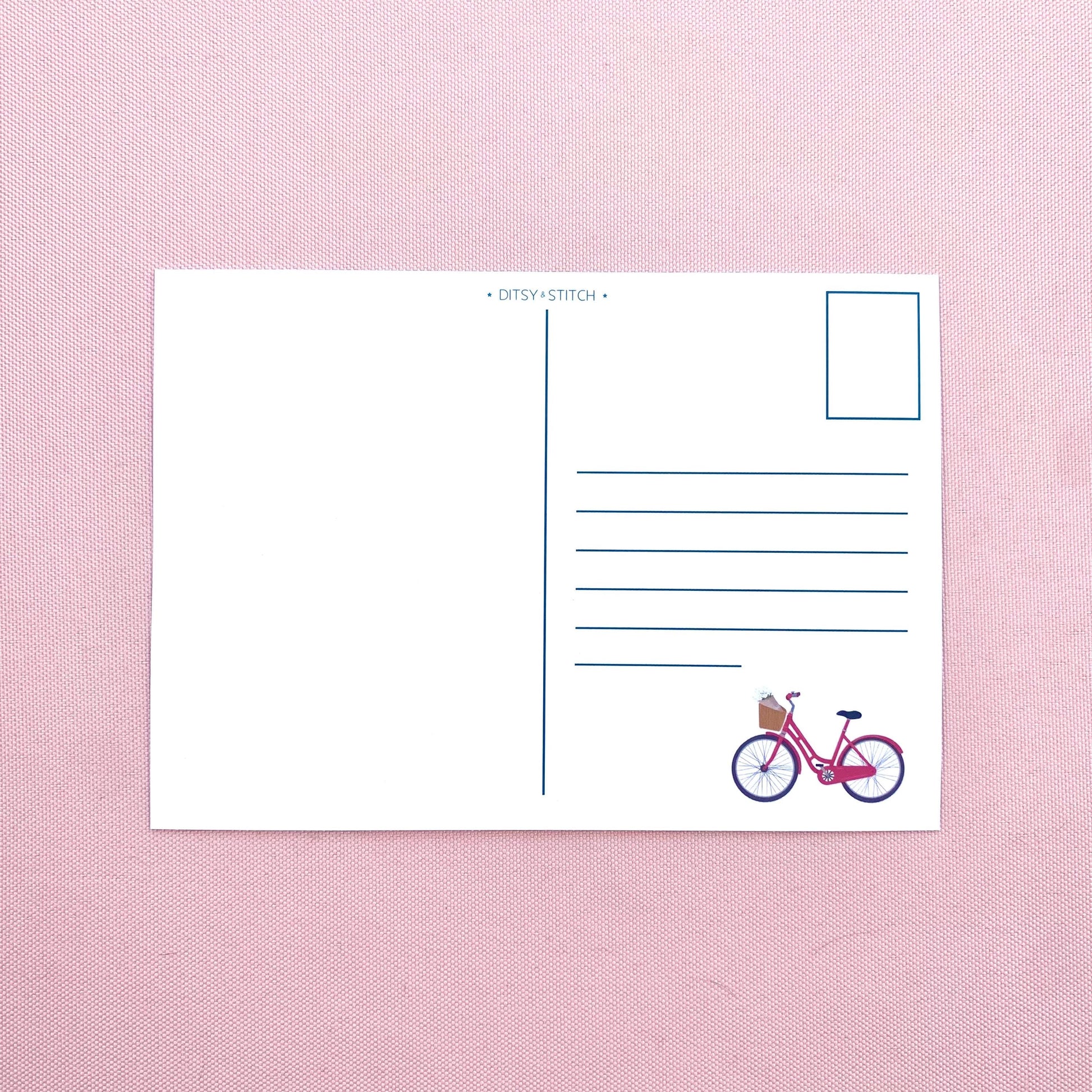 Postcard with a bicycle illustration on a pink textured background