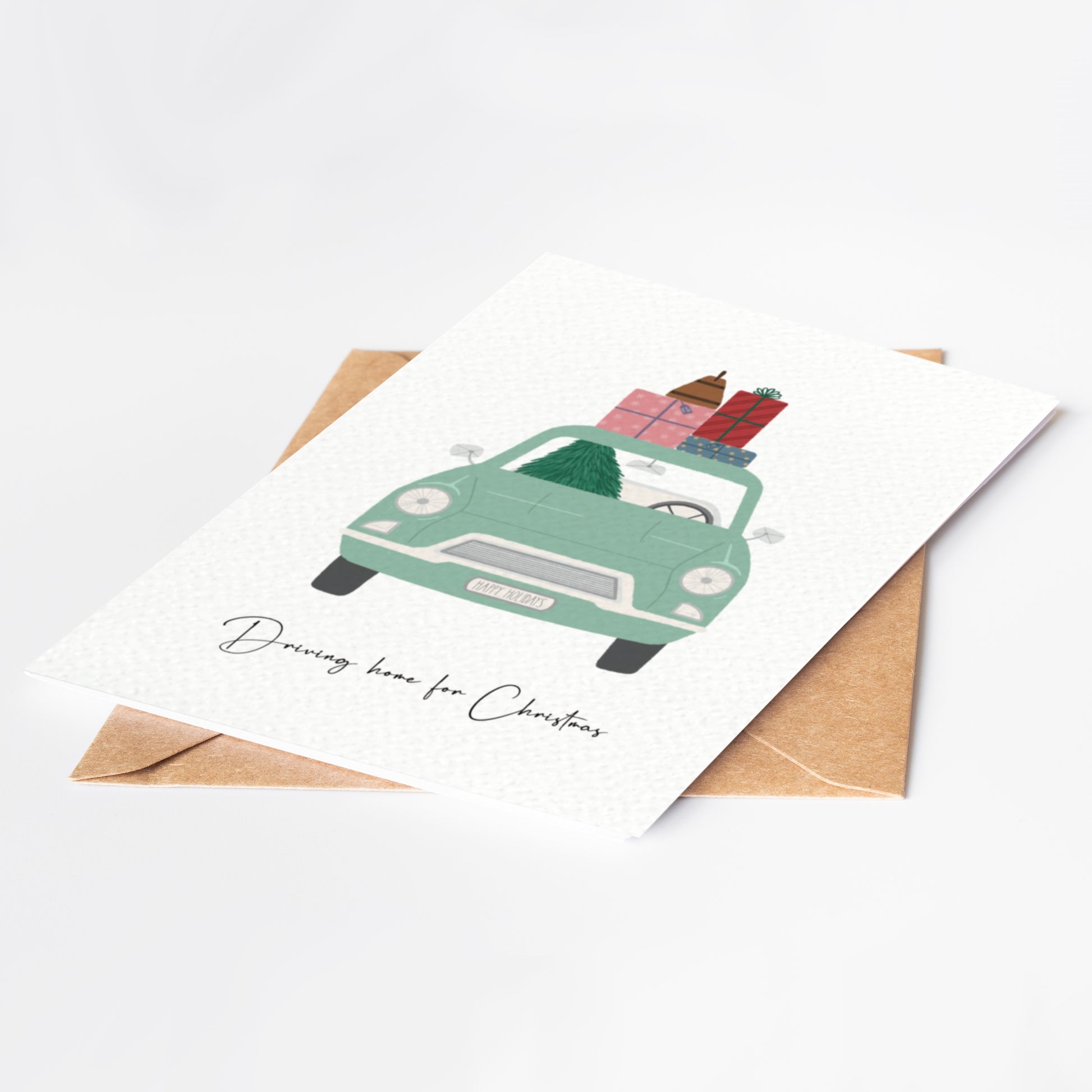 Greeting card with a green car carrying Christmas presents on a white background
