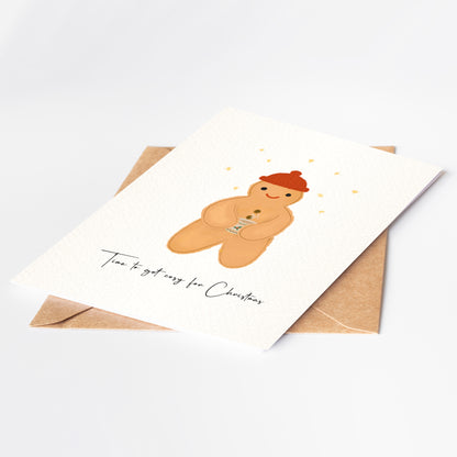 Greeting card with a gingerbread man illustration and envelope on a white background