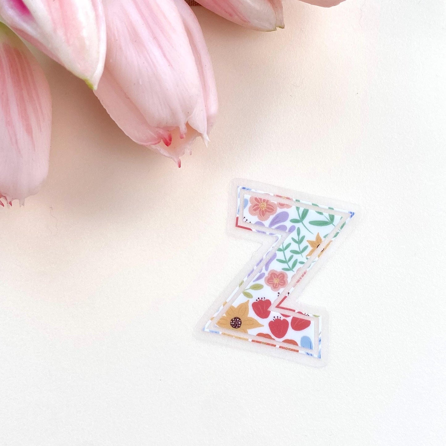 Decorative letter 'Z' sticker with floral patterns on a white background