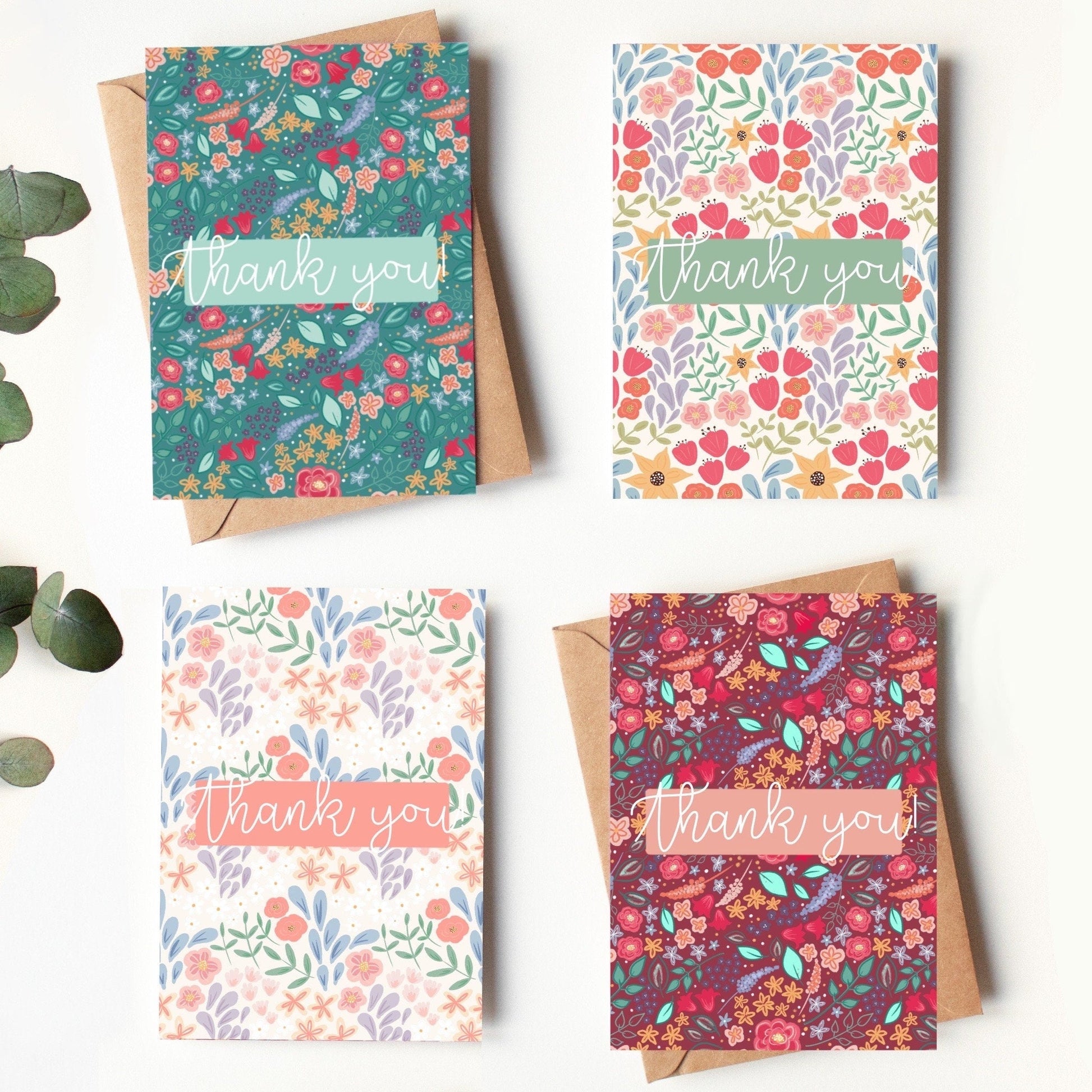 Four floral greeting cards with 'Thank you' text on a white background.